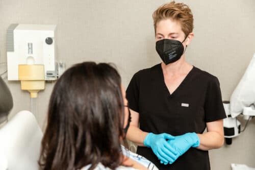 scherl-dermatology-dr-rothman-speaking-with-patient dermatologist explaining hives treatment to the patient