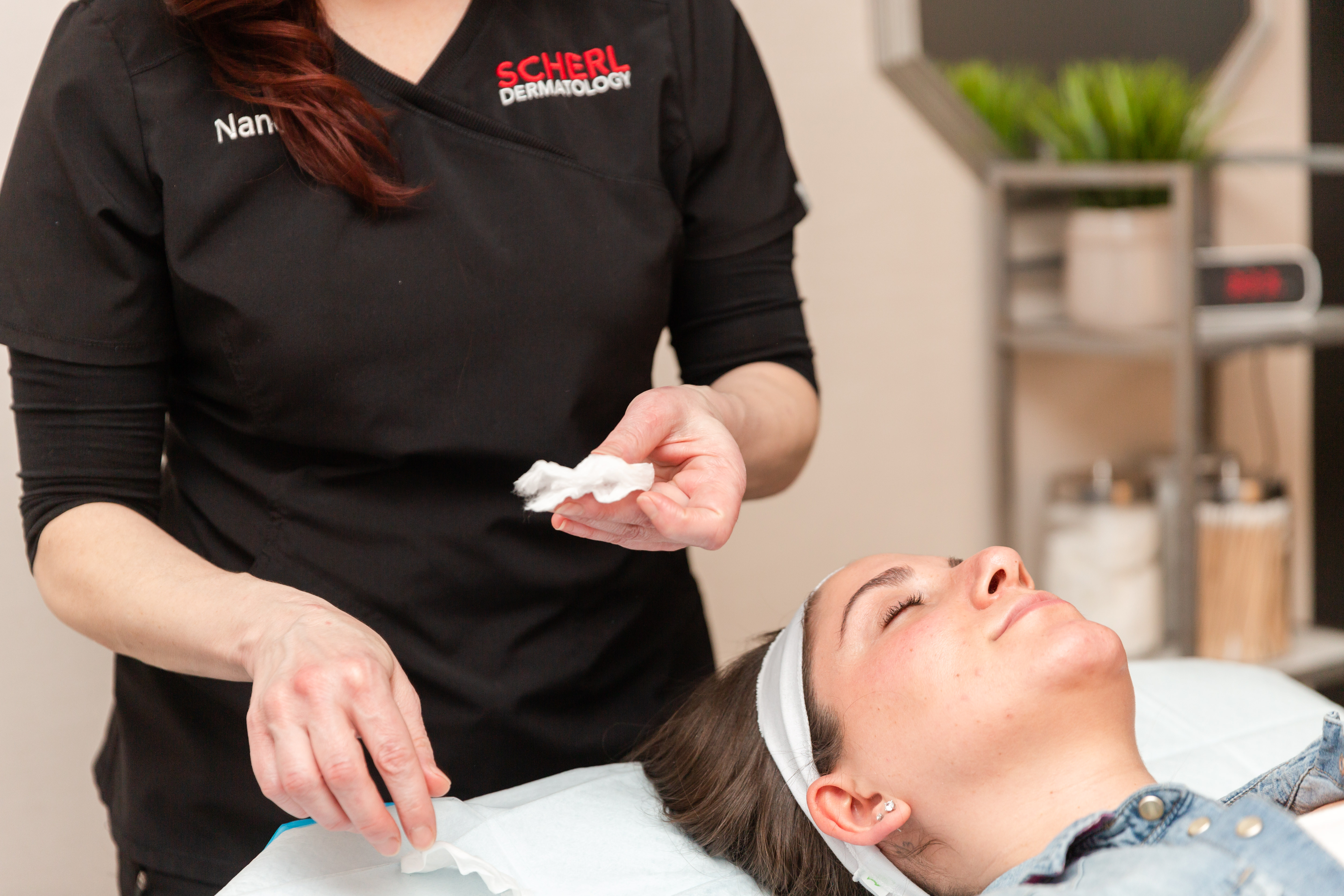 dermatologist preparing to treat acne on a patient from englewood cliffs